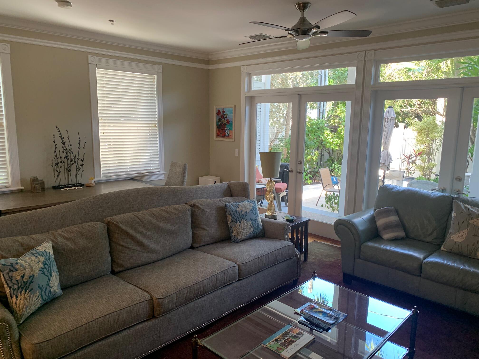 807 Washington Street, Unit 101 Key West, FL 33040 - Photo 9 of 29 a living room with furniture and a large window