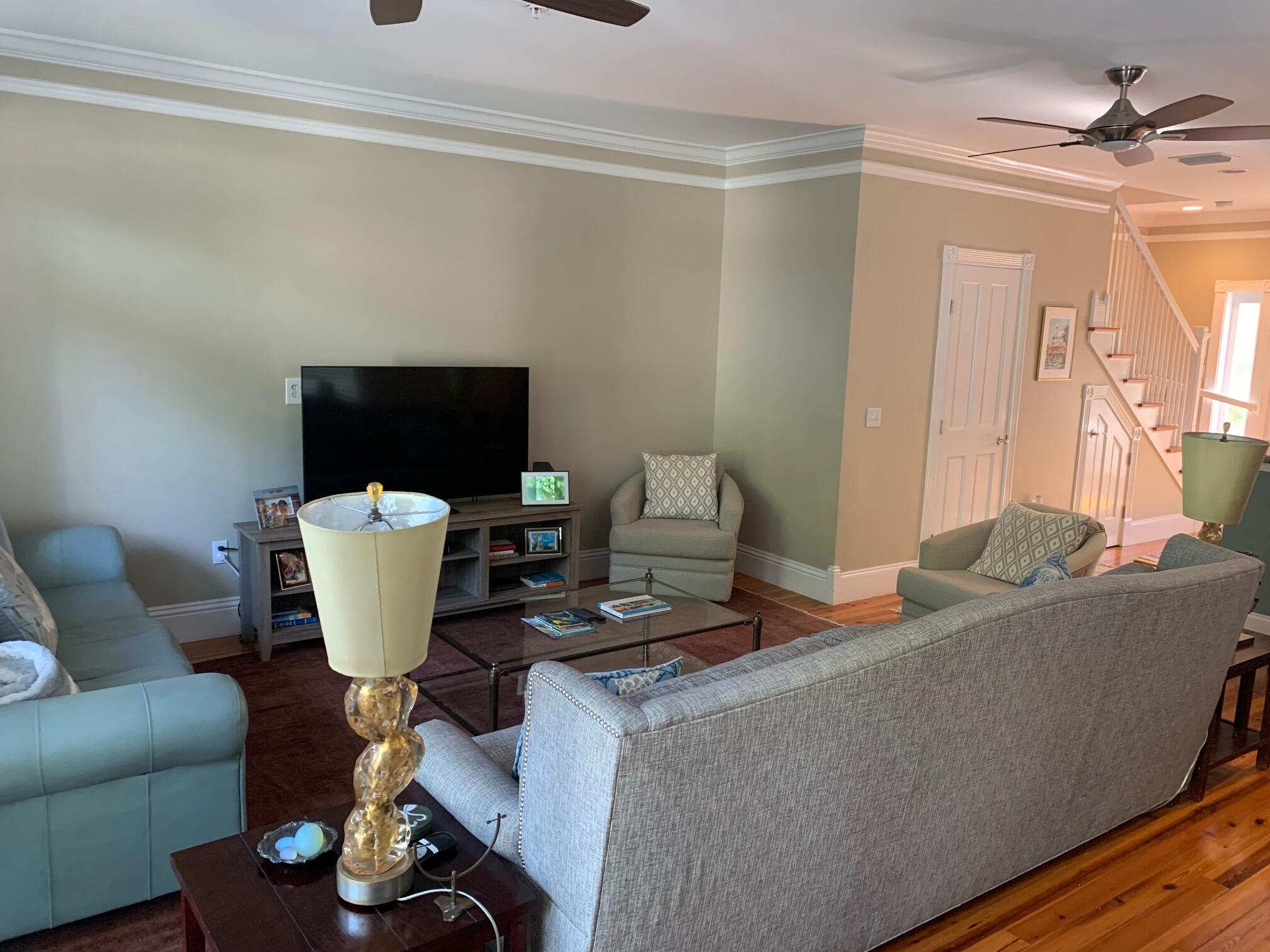 807 Washington Street, Unit 101 Key West, FL 33040 - Photo 10 of 29 a living room with furniture a flat screen tv and a window