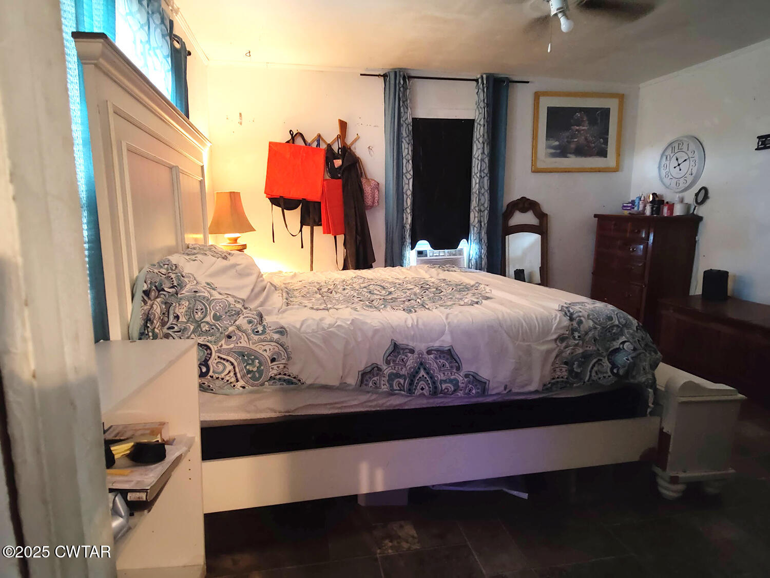 533 East 3rd Street Trenton, TN 38382 - Photo 8 of 12 a bedroom with a bed and dresser with mirror