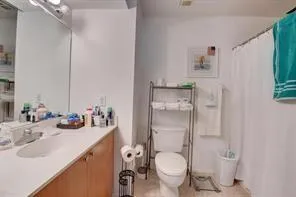 a bedroom with a bed and a television