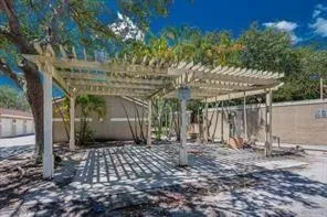 a view of a lake with a table and chairs