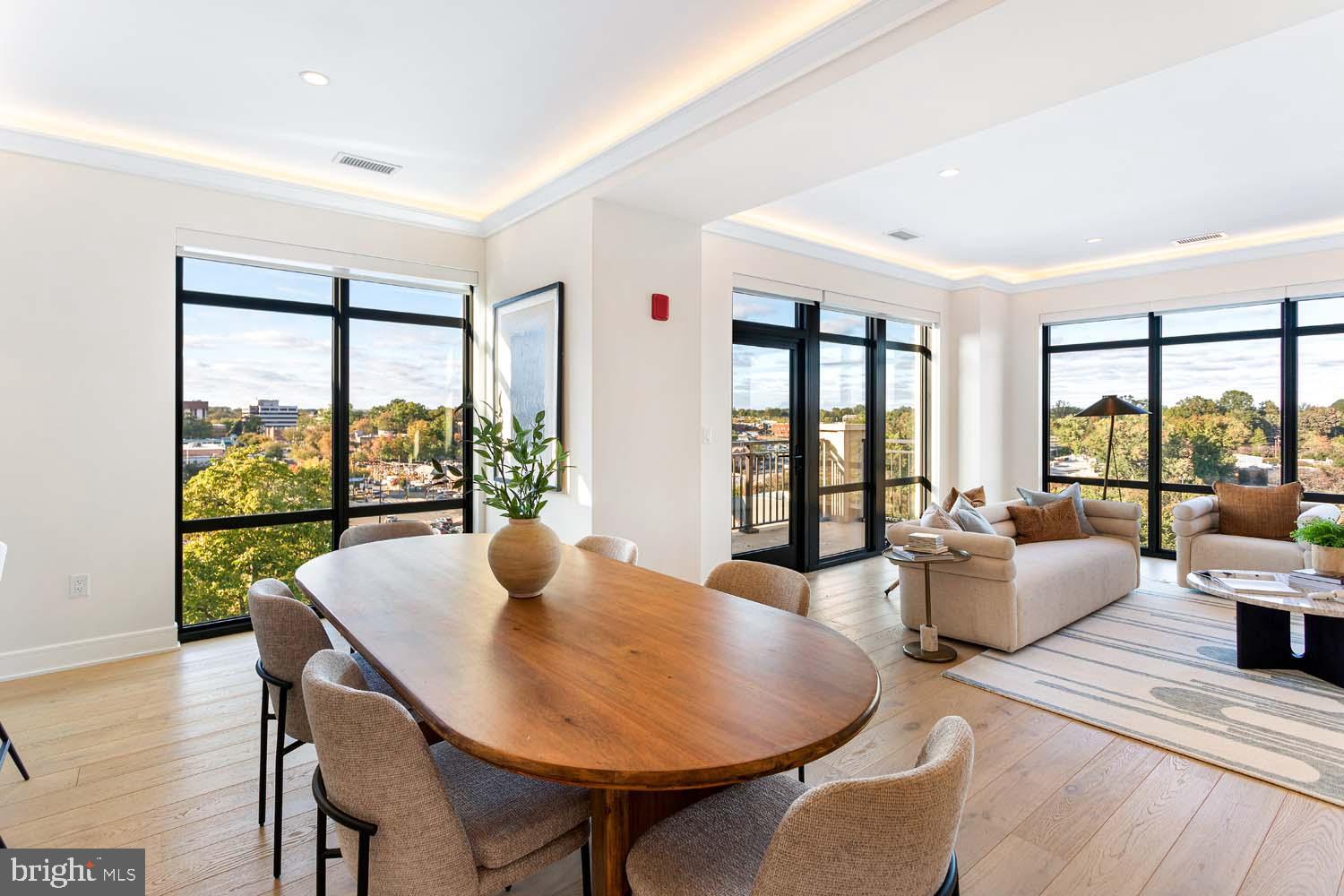 6718 Lowell Avenue, Unit 702 McLean, VA 22101 - Photo 11 of 75 a living room with furniture and a floor to ceiling window