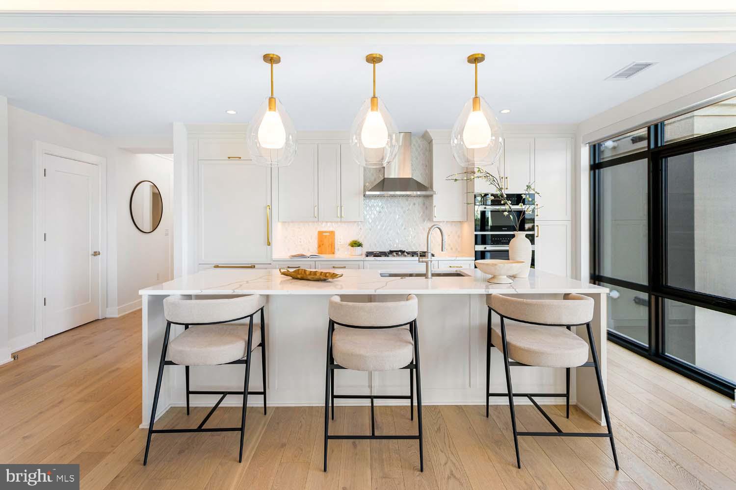 6718 Lowell Avenue, Unit 702 McLean, VA 22101 - Photo 12 of 75 a kitchen with a sink cabinets and wooden floor