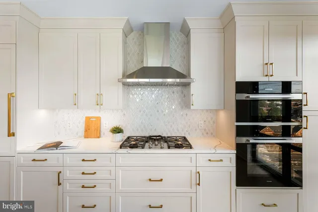 a large bedroom with a large bed and large windows