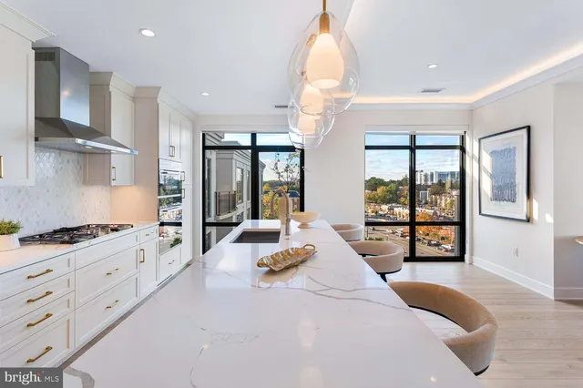 a bedroom with bed and a large window