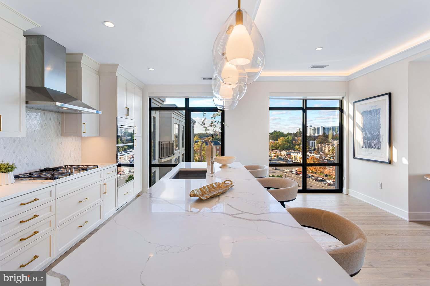 6718 Lowell Avenue, Unit 702 McLean, VA 22101 - Photo 18 of 75 a large bedroom with a large bed and large windows