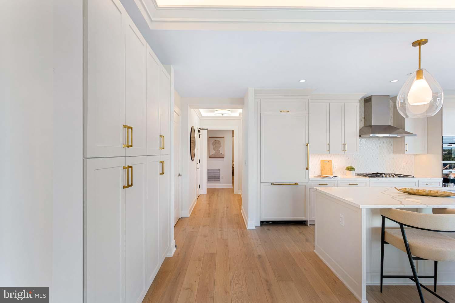6718 Lowell Avenue, Unit 702 McLean, VA 22101 - Photo 19 of 75 a view of a kitchen from the hallway