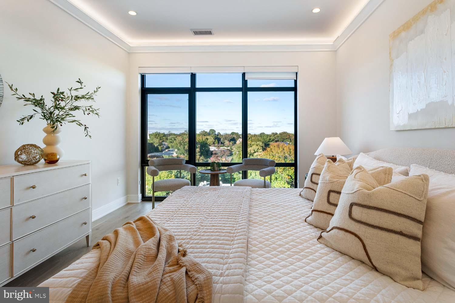 6718 Lowell Avenue, Unit 702 McLean, VA 22101 - Photo 21 of 75 a living room with furniture and a large window