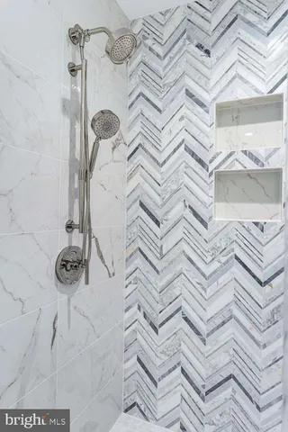 a close view of a utility room with washer and dryer