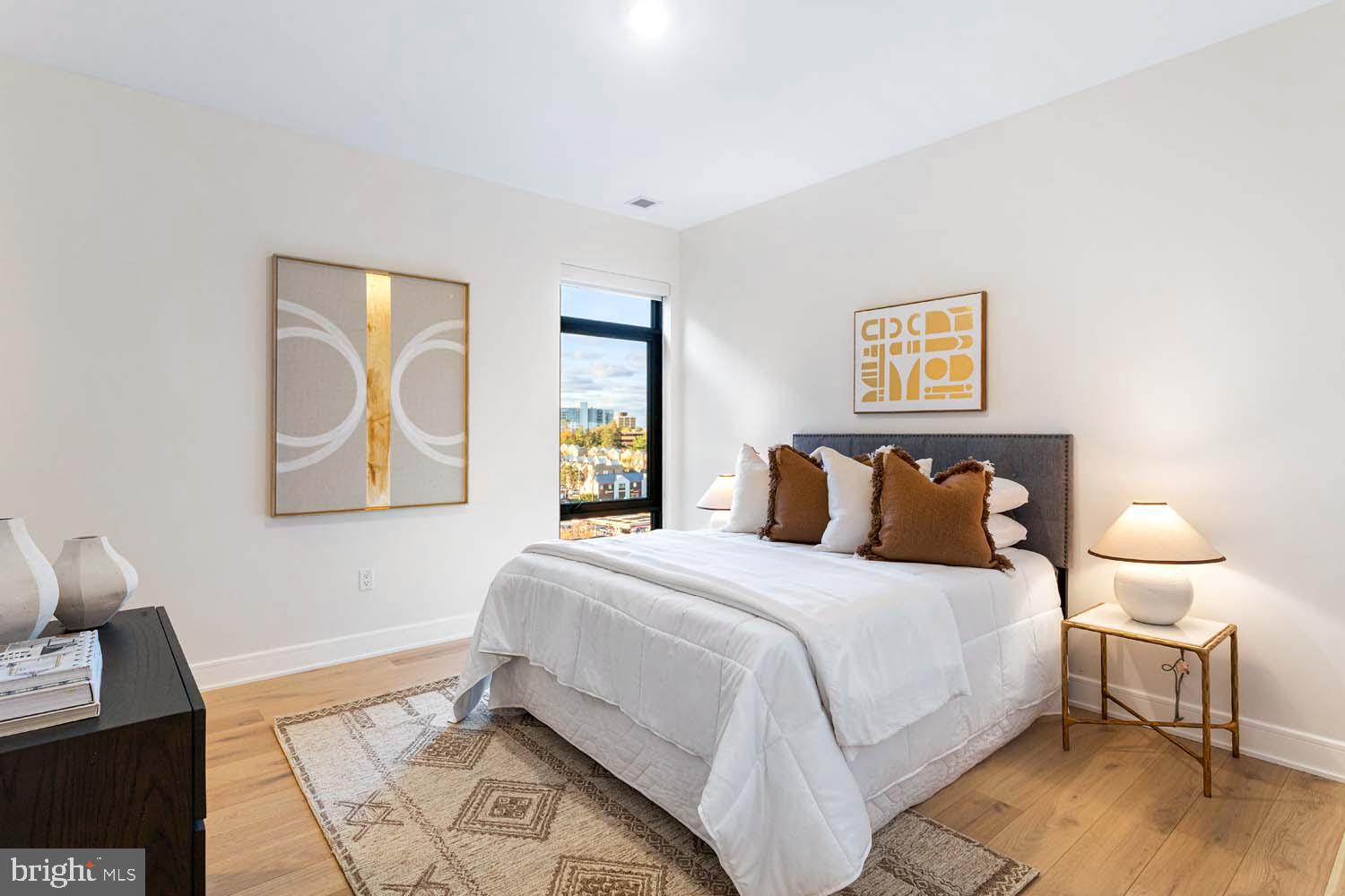 6718 Lowell Avenue, Unit 702 McLean, VA 22101 - Photo 29 of 75 a bedroom with a bed and night stand