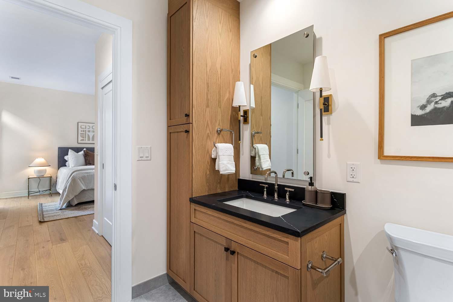 6718 Lowell Avenue, Unit 702 McLean, VA 22101 - Photo 34 of 75 a bathroom with a sink and a mirror