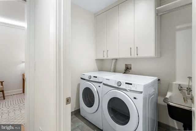 a dining room with furniture and a large window