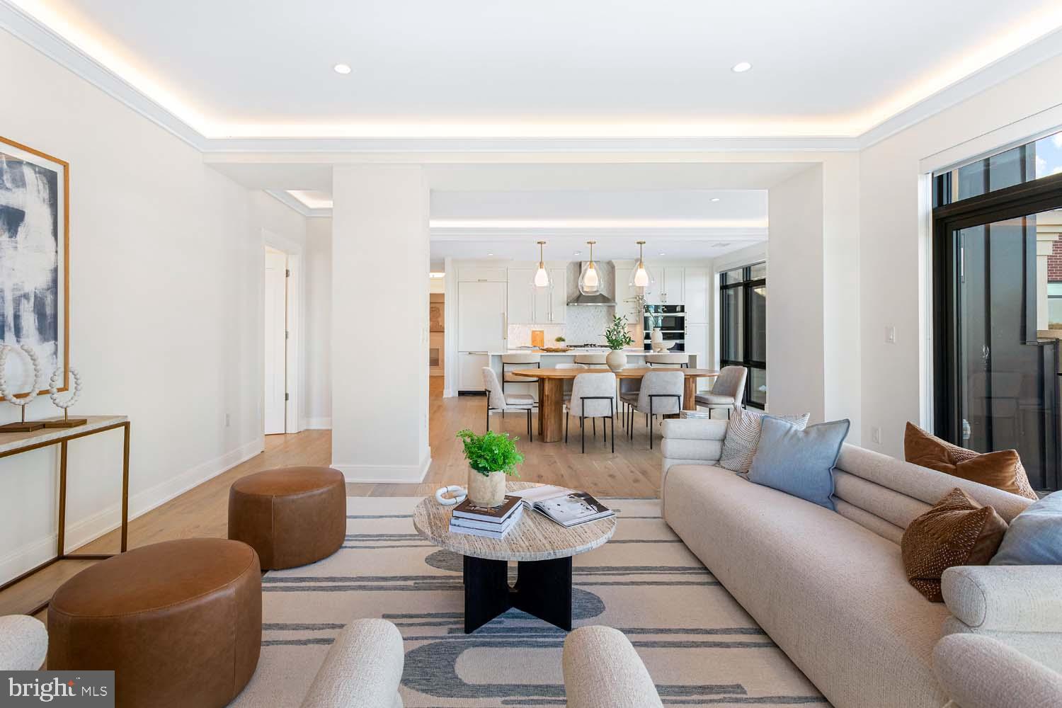 6718 Lowell Avenue, Unit 702 McLean, VA 22101 - Photo 4 of 75 a living room with furniture and a view of kitchen