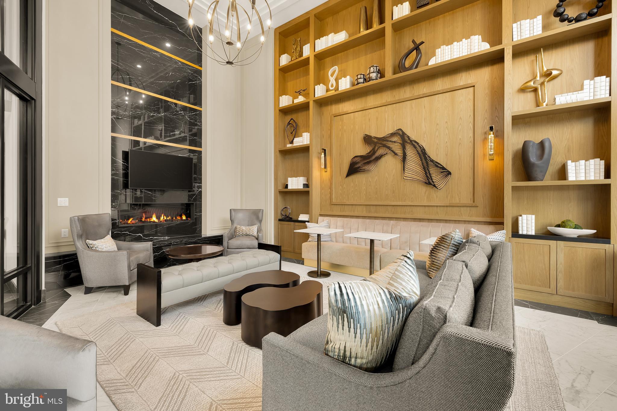 6718 Lowell Avenue, Unit 702 McLean, VA 22101 - Photo 43 of 75 a living room with furniture and a flat screen tv