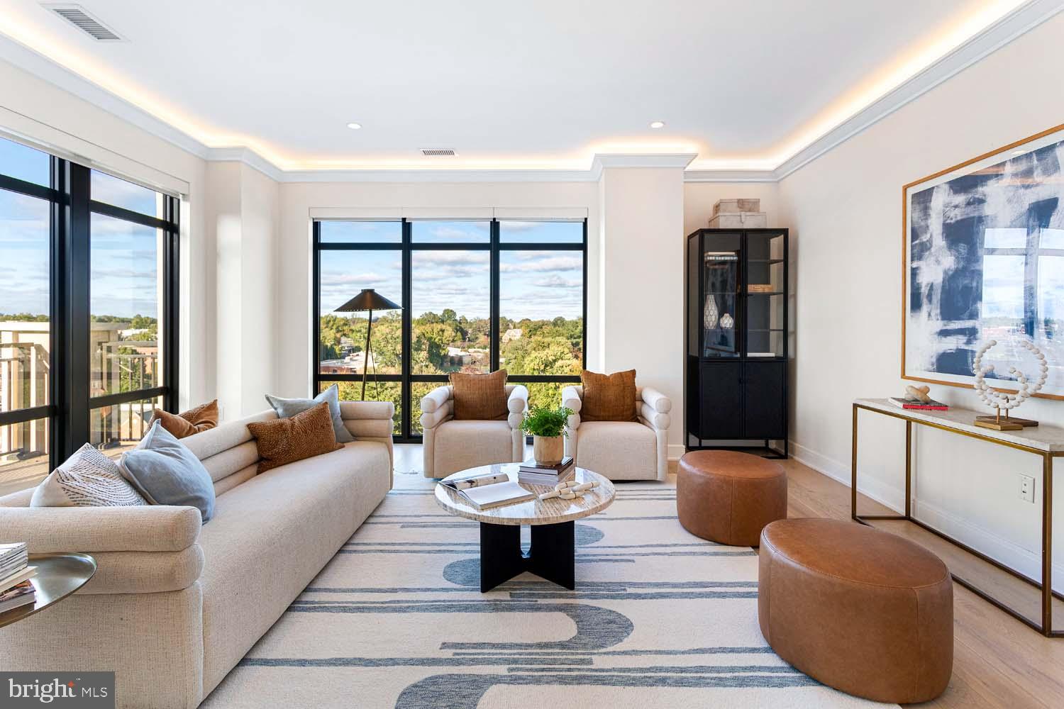 6718 Lowell Avenue, Unit 702 McLean, VA 22101 - Photo 6 of 75 a living room with furniture and floor to ceiling windows