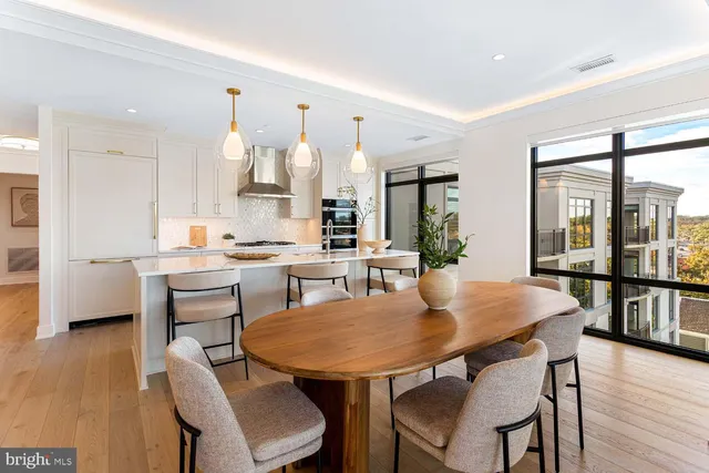 a kitchen with a sink cabinets and wooden floor