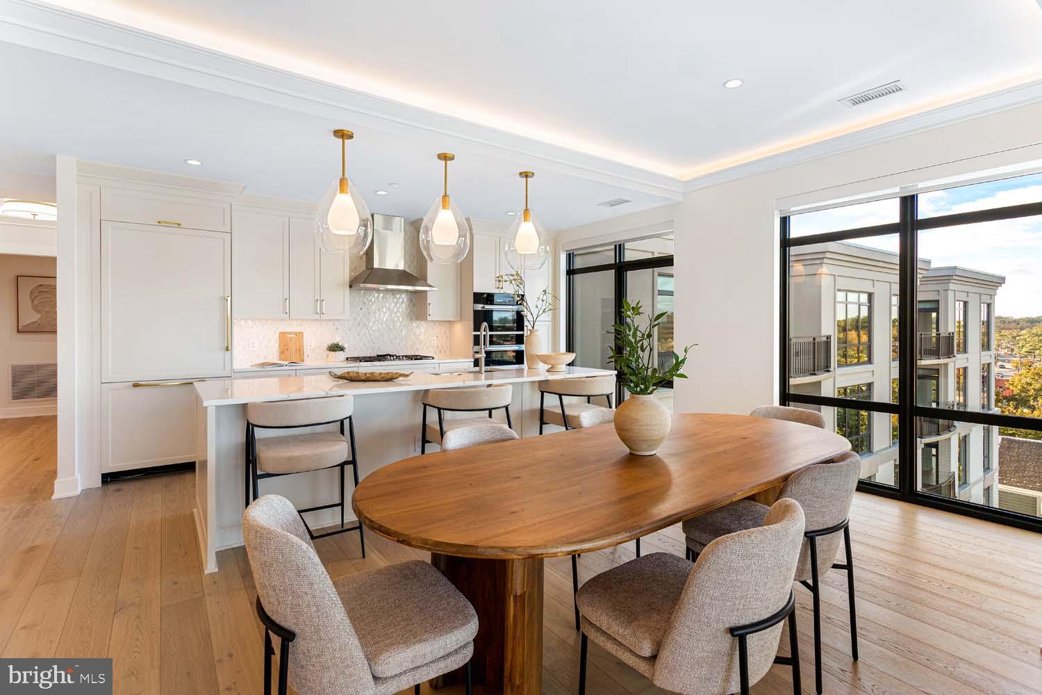6718 Lowell Avenue, Unit 702 McLean, VA 22101 - Photo 10 of 75 a view of a dining room with furniture and wooden floor