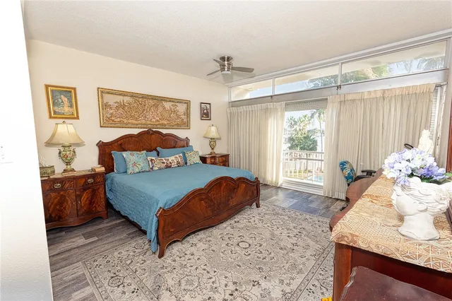 a bedroom with a bed window and dresser