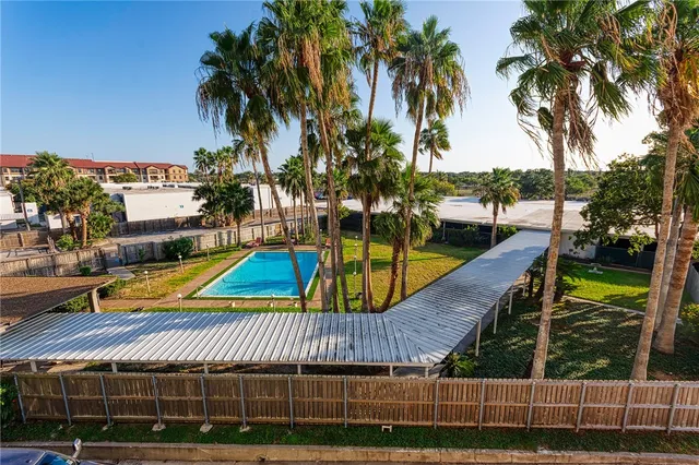 a view of swimming pool with seating area and water view