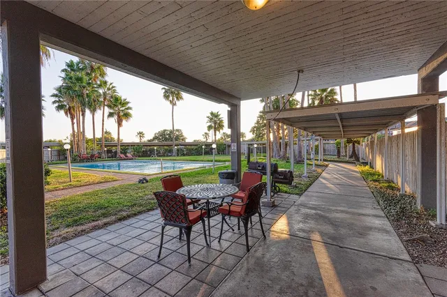 a view of a patio with a garden