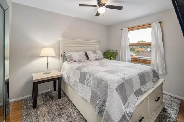 a bedroom with a bed and a lamp