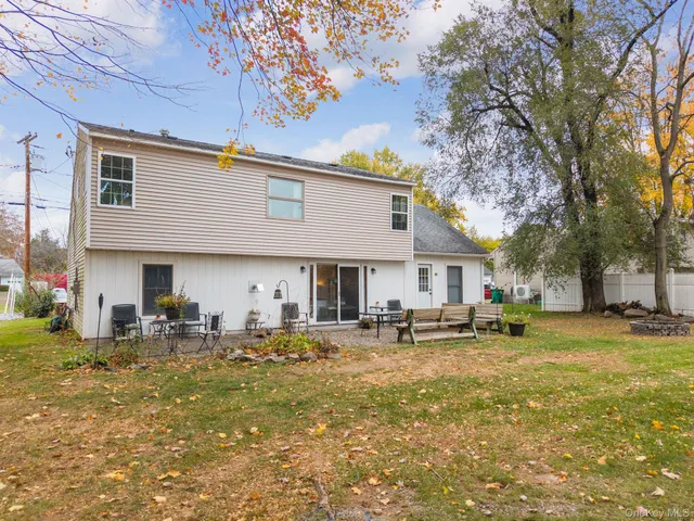 a group of chairs sitting in front of a house