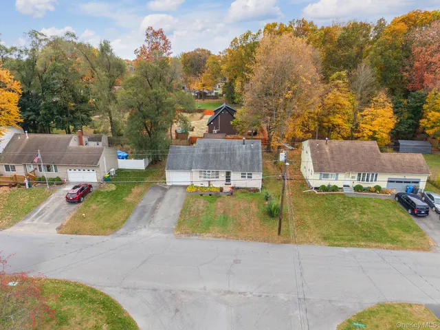 a view of a swimming pool with a yard