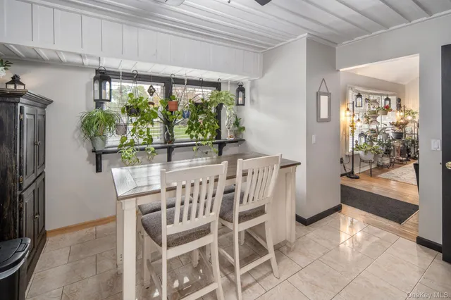 a view of a dining room with furniture window and outside view