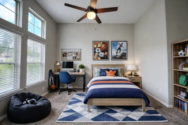a bedroom with a bed a bookshelf and a window