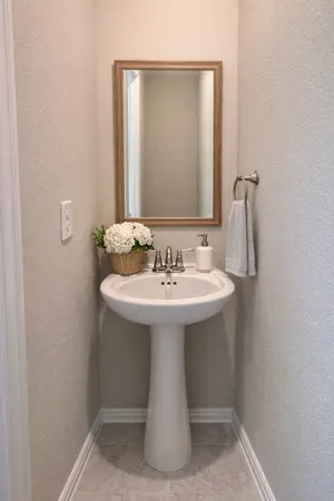 a bathroom with a sink a mirror and shower