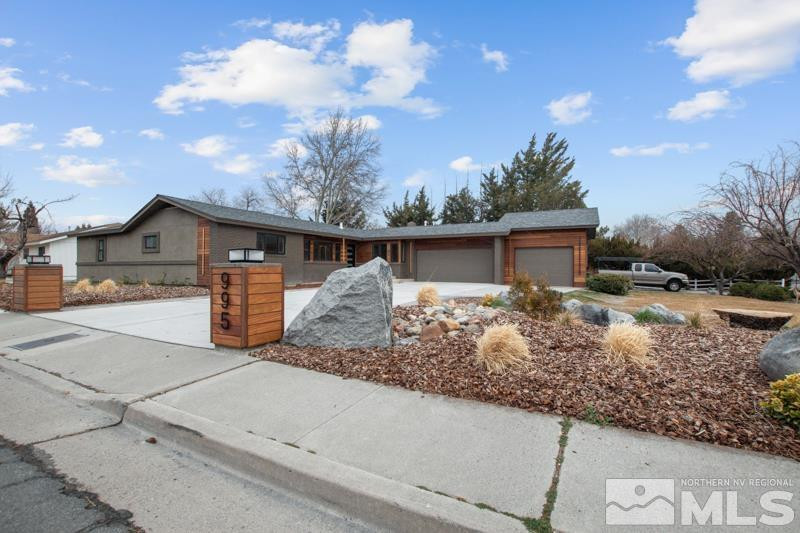 995 Skyline Boulevard Reno, NV 89509 - Photo 1 of 34 a front view of house with yard covered in the background