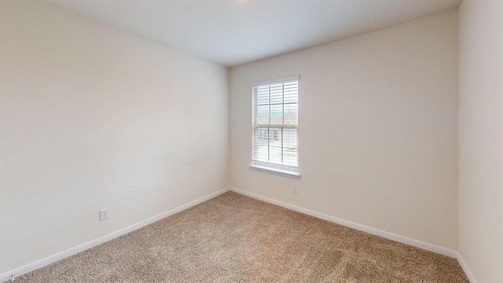 1306 Colonial Bluff Lane Princeton, TX 75407 - Photo 18 of 27 Carpeted room featuring light-colored walls and a window with blinds