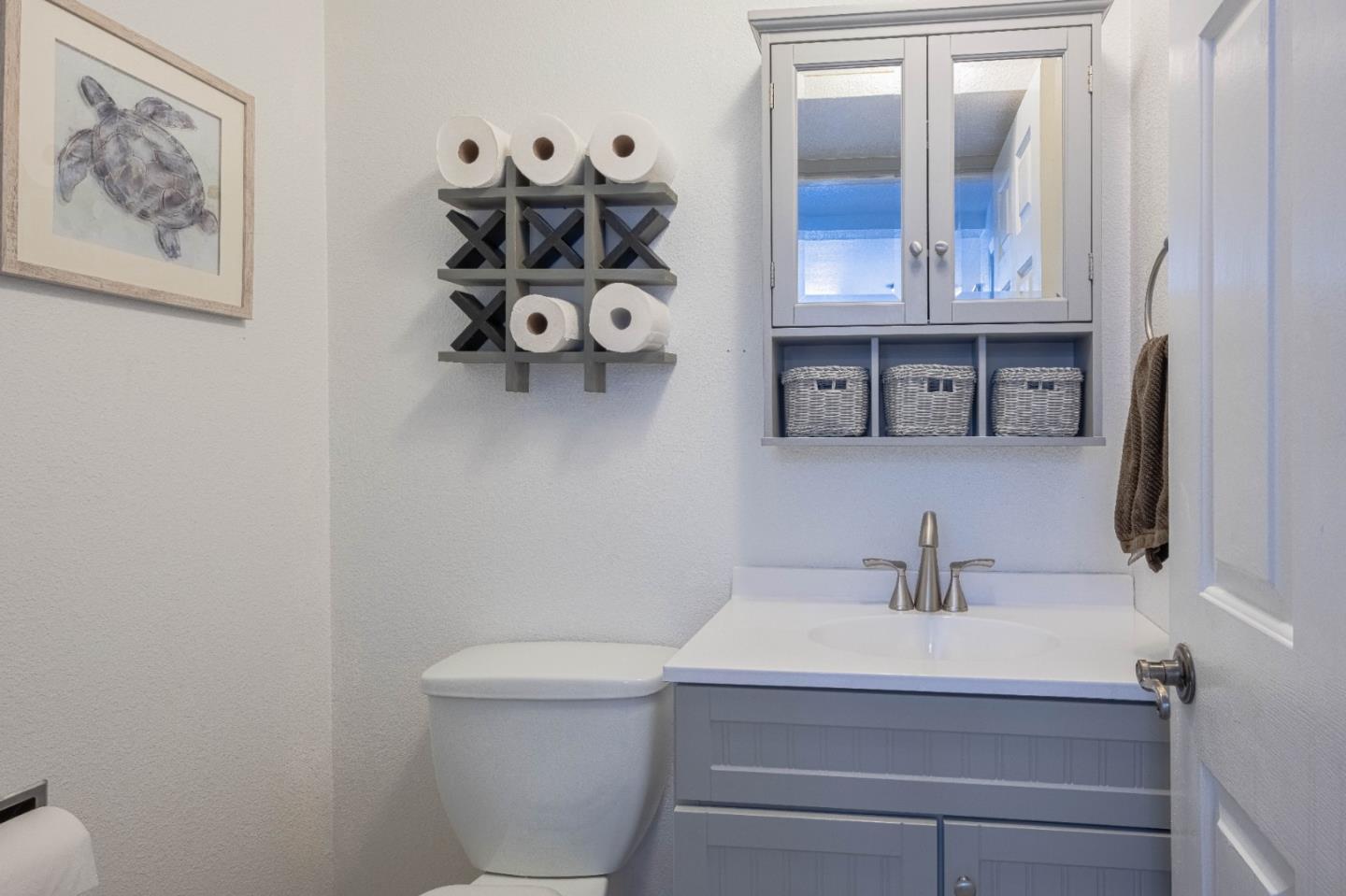 143 Tucker Road Watsonville, CA 95076 - Photo 19 of 42 a bathroom with a sink and a toilet