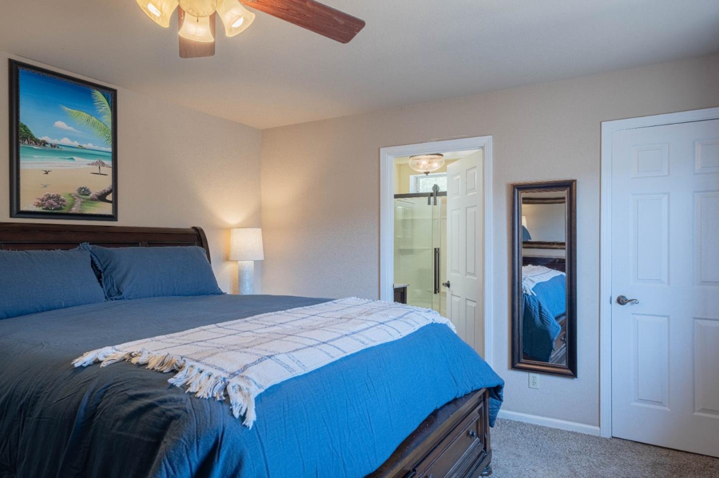 143 Tucker Road Watsonville, CA 95076 - Photo 22 of 42 a bedroom with a bed and a painting on the wall