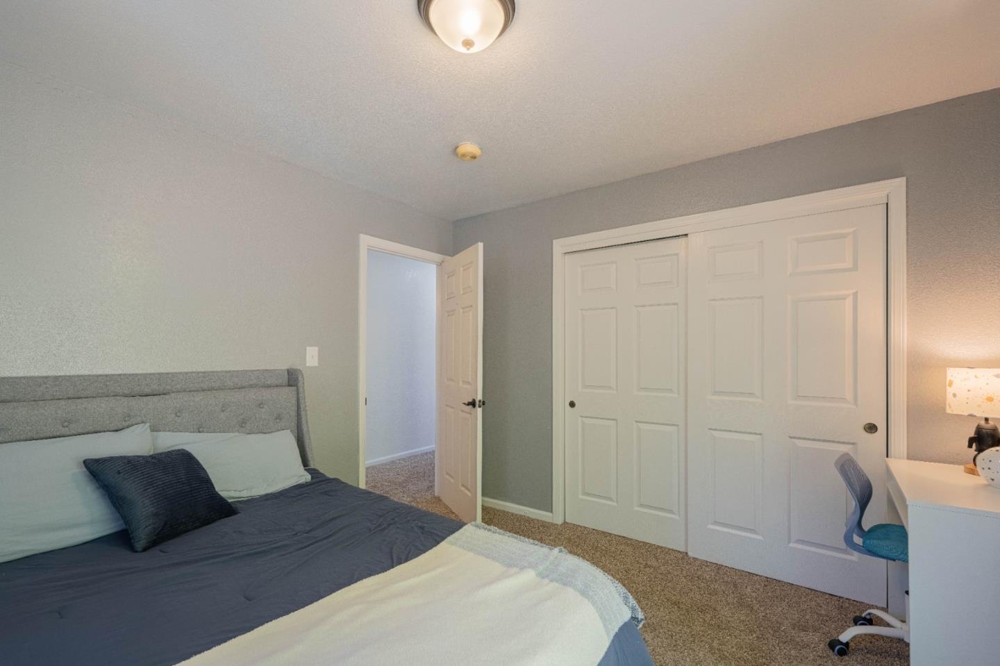 143 Tucker Road Watsonville, CA 95076 - Photo 30 of 42 a bedroom with a bed and a window