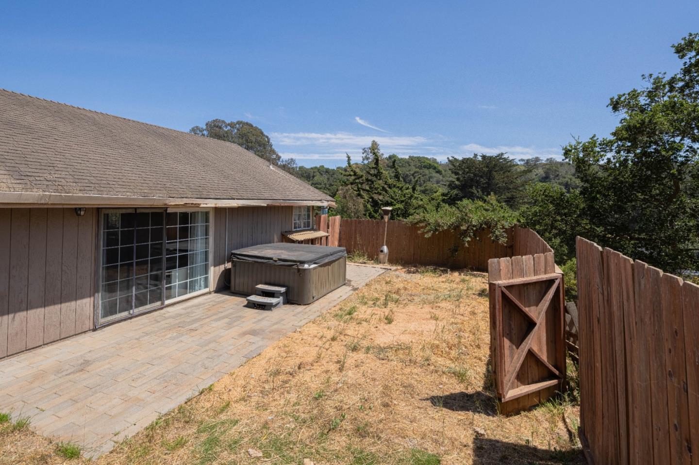 143 Tucker Road Watsonville, CA 95076 - Photo 5 of 42 a house with trees in the background
