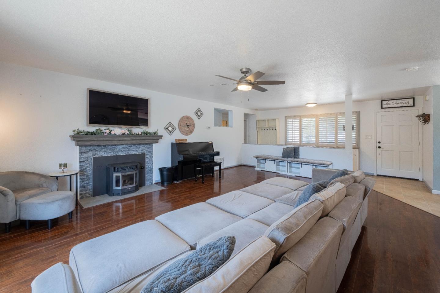 143 Tucker Road Watsonville, CA 95076 - Photo 7 of 42 a living room with furniture fireplace and flat screen tv