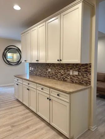 a kitchen with stainless steel appliances a white stove top oven cabinets a refrigerator and a stove