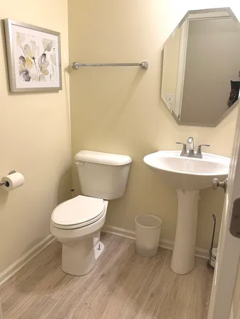 a spacious bedroom with a bed and a dresser