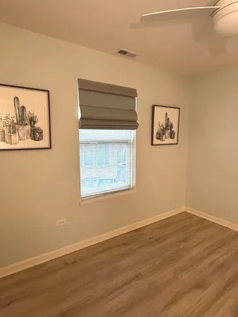 a bathroom with a toilet a sink and a mirror