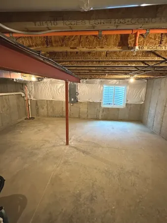 a front view of a building with trees