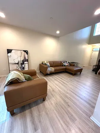 a living room with stainless steel appliances kitchen island granite countertop furniture and a kitchen view