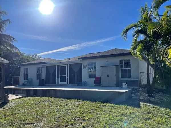 a view of a house with a small yard