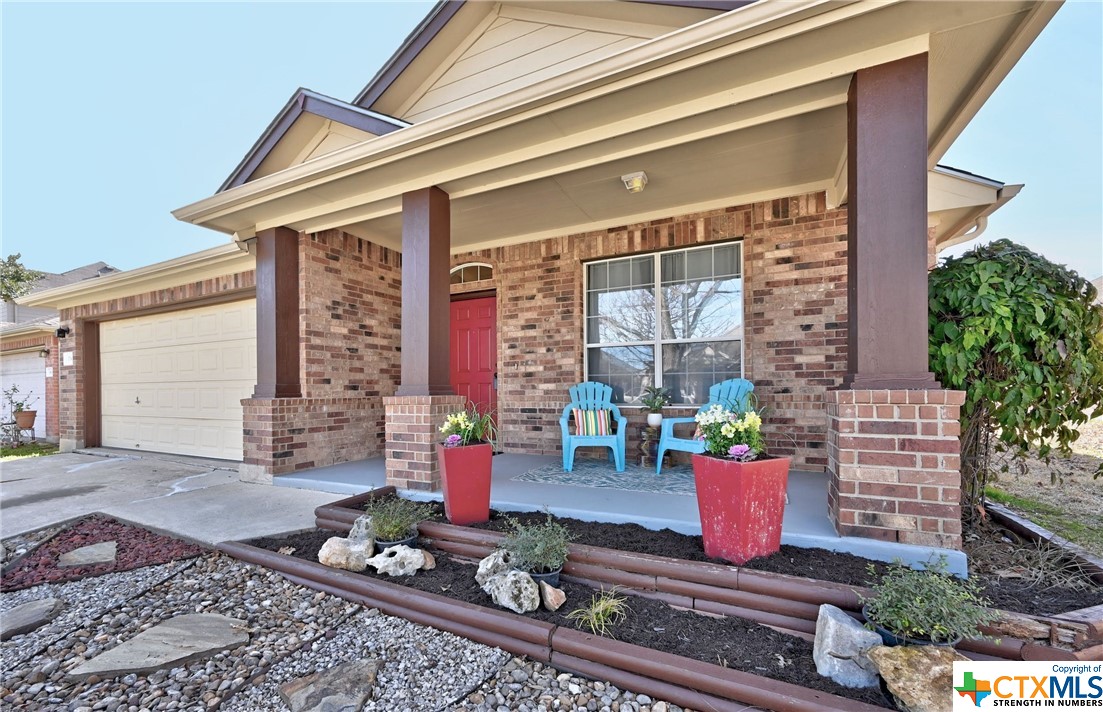 a front view of a house with chairs