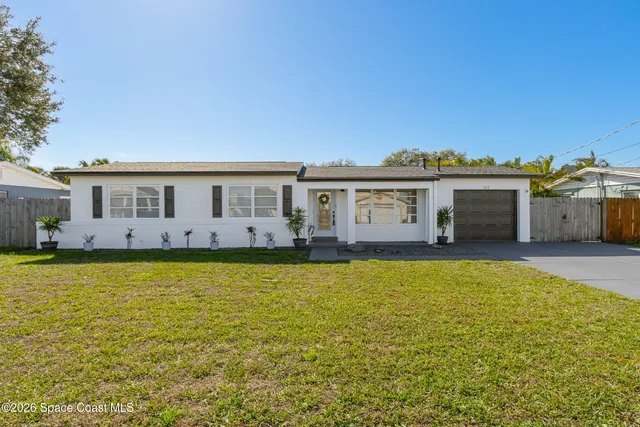a view of house with swimming pool outdoor seating and yard