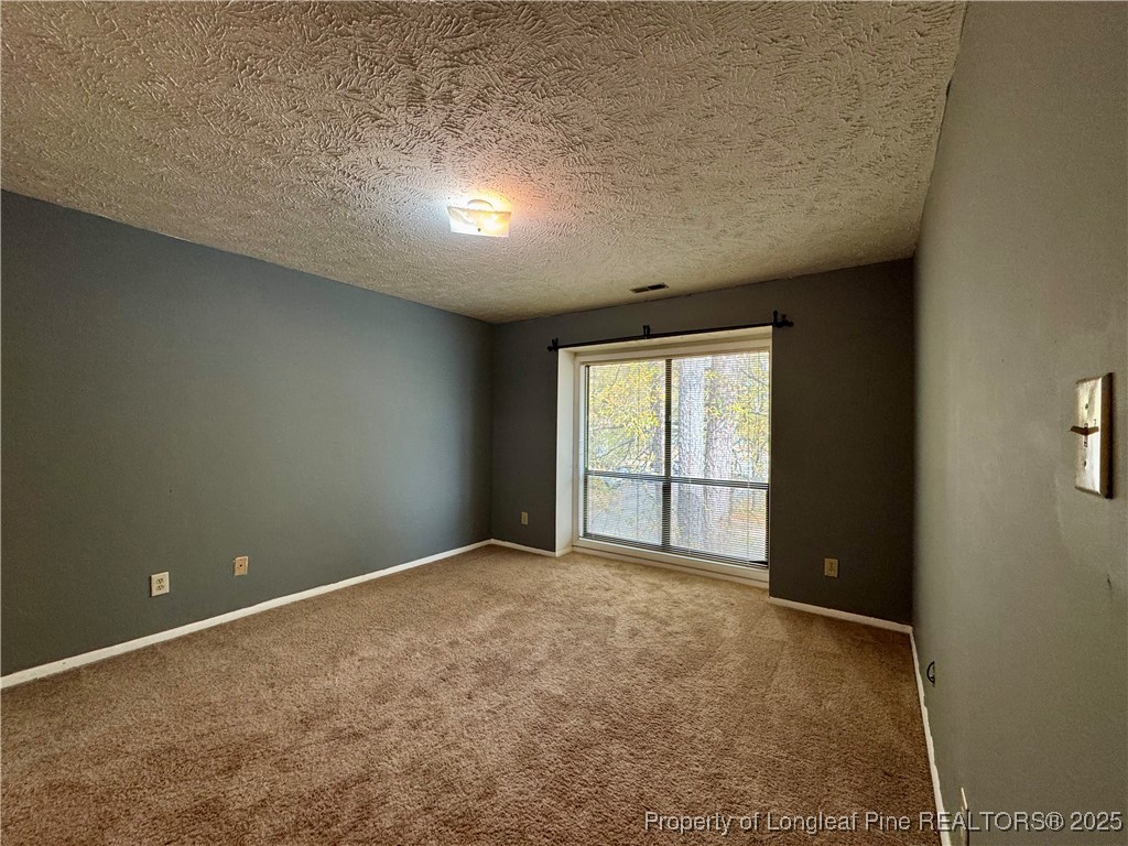 1899 Tryon Drive, Unit 8 Fayetteville, NC 28303 - Photo 11 of 21 an empty room with windows