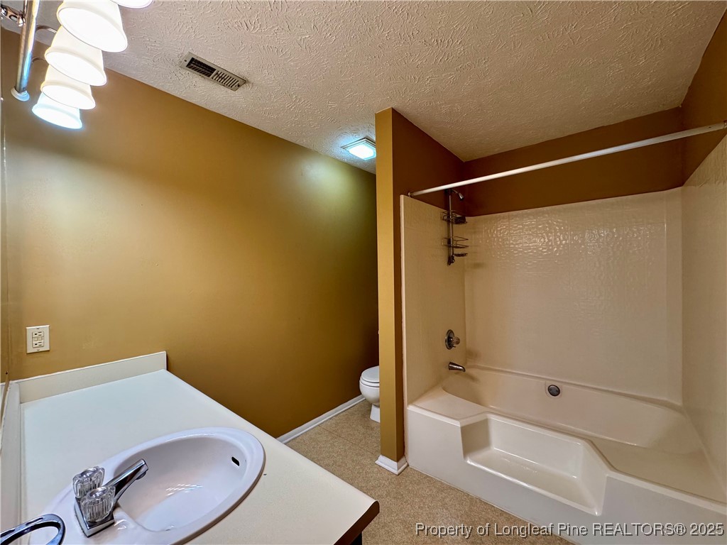 1899 Tryon Drive, Unit 8 Fayetteville, NC 28303 - Photo 14 of 21 a bathroom with a sink and toilet