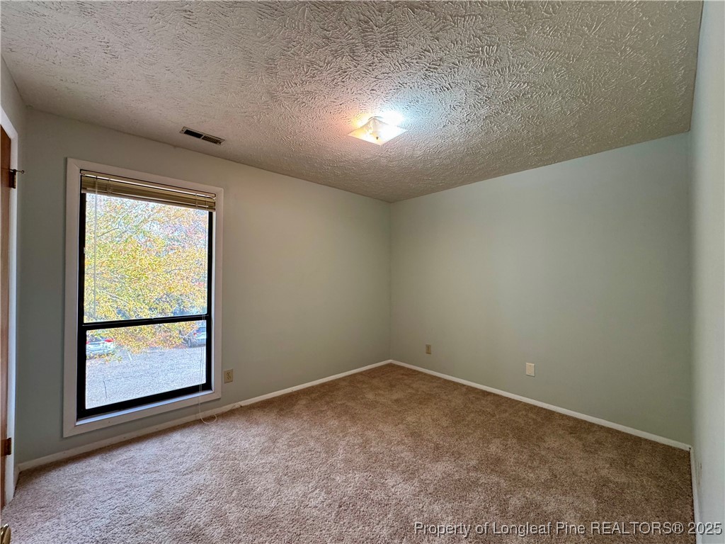 1899 Tryon Drive, Unit 8 Fayetteville, NC 28303 - Photo 16 of 21 an empty room with a window