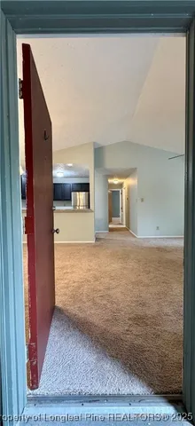 a view of a kitchen with a sink and a window
