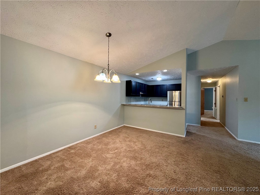 1899 Tryon Drive, Unit 8 Fayetteville, NC 28303 - Photo 4 of 21 a view of a room with a kitchen